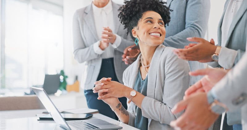 applause-celebration-business-woman-with-good-news-achievement-job-promotion-office-happy-wow-professional-employee-from-mexico-with-success-celebrating-with-support-from-team