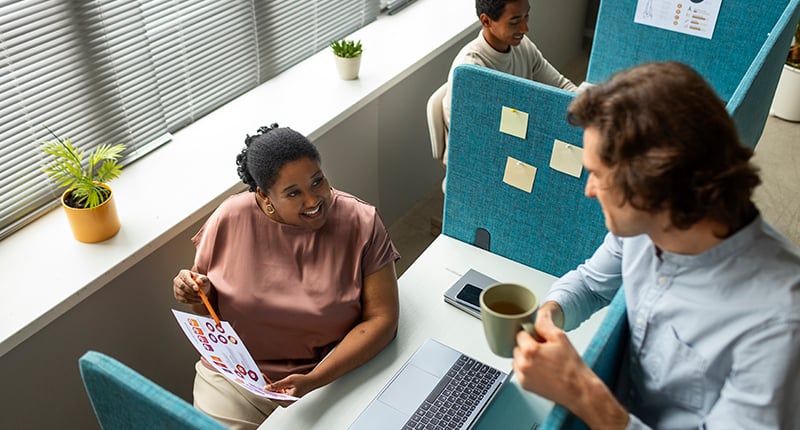 high-angle-people-discussing-work