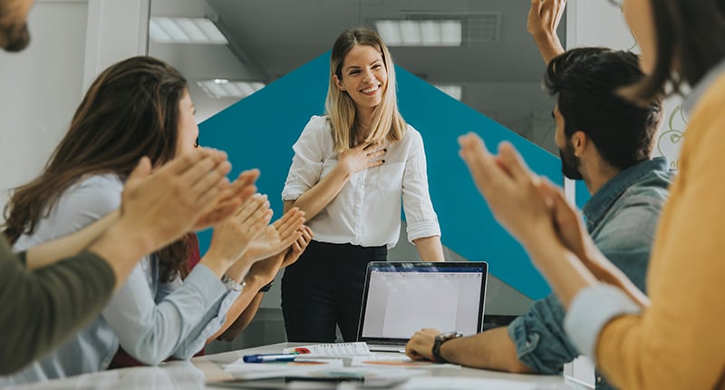 pretty-female-team-leader-talking-with-mixed-race-group-people-office