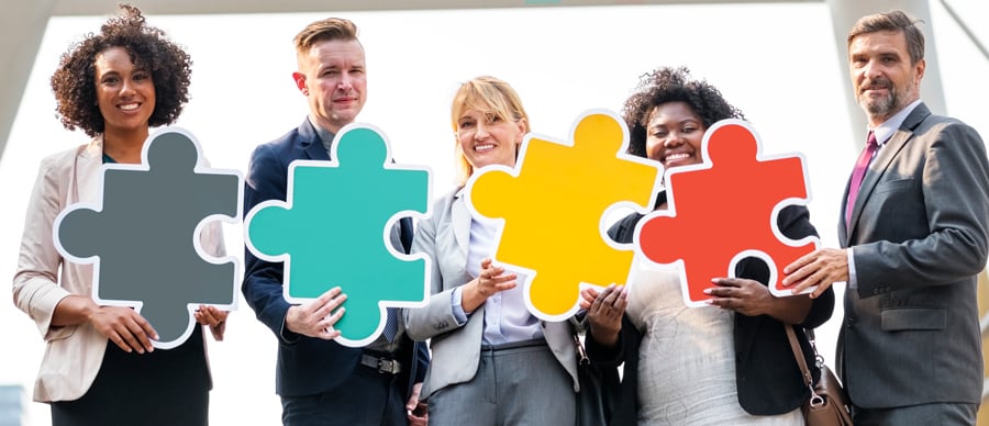 business-people-connected-by-puzzle-pieces